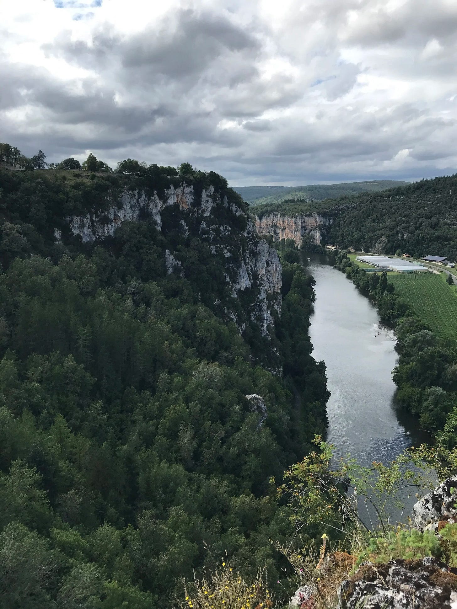 A closeup view of Lot River and surrounding cliffs at Saint Cirq Lapopie, France A closeup view of Lot River and surrounding cliffs at Saint Cirq Lapopie, France