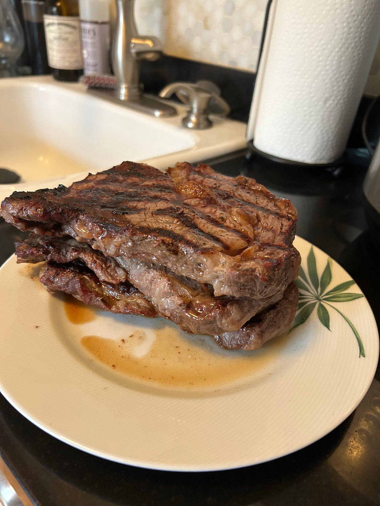 three grilled steaks