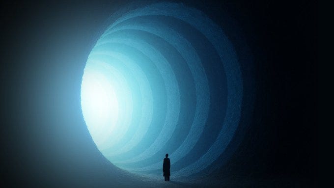 A silhouette of a person standing in front of a tunnel of light. The tunnel has concentric circular patterns that emit a bright blue light, creating a sense of depth and perspective. The person is facing towards the light, suggesting a journey or transition.