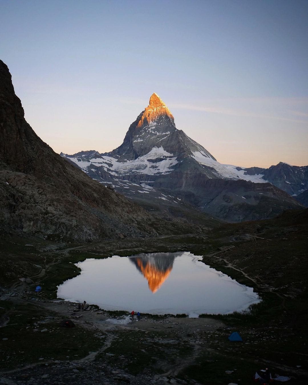 mountain with a glowing red top