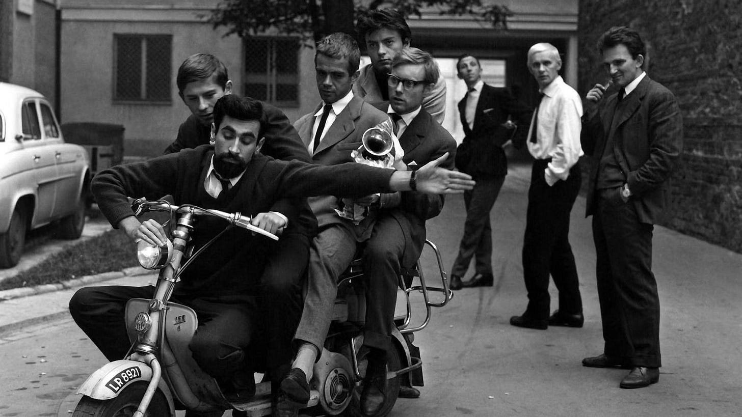 Various Polish actors and real-life jazz musicians either crowd onto a single scooter or look on from the sidelines. (Jan Zylber, Roman Polański, Andrzej Trzaskowski, Andrzej Nowakowski, Henryk Kurek, Tadeusz Łomnicki and Andrzej Wojciechowski.) Various Polish actors and real-life jazz musicians either crowd onto a single scooter or look on from the sidelines. (Jan Zylber, Roman Polański, Andrzej Trzaskowski, Andrzej Nowakowski, Henryk Kurek, Tadeusz Łomnicki and Andrzej Wojciechowski.)