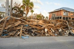 Street-side Heaps Of Storm Debris And Trash Left Behind By Hurricane Milton On Manasota Key In Englewood, Florida. Severe Damage To Homes From Storm Surge. Harsh Aftermath Of The Natural Disaster