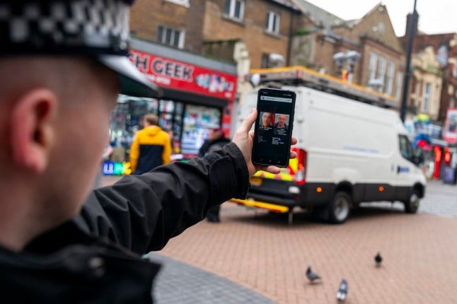 EDITORS NOTE FACES BLURRED BY THE PA PICTURE DESK A Metropolitan Police officer demonstrates the smart phone application used by the Met's live facial recognition technology in Croydon, south London. The technology is used to tackle crime and identify offenders, helping officers to target those wanted for causing serious violence. Picture date: Friday February 9, 2024. PA Photo. See PA story POLICE FacialRecognition. Photo credit should read: Jordan Pettitt/PA Wire EDITORS NOTE FACES BLURRED BY THE PA PICTURE DESK A Metropolitan Police officer demonstrates the smart phone application used by the Met's live facial recognition technology in Croydon, south London. The technology is used to tackle crime and identify offenders, helping officers to target those wanted for causing serious violence. Picture date: Friday February 9, 2024. PA Photo. See PA story POLICE FacialRecognition. Photo credit should read: Jordan Pettitt/PA Wire