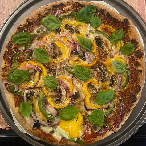 Homemade Pizza with wholewheat crust in three stages of the making.