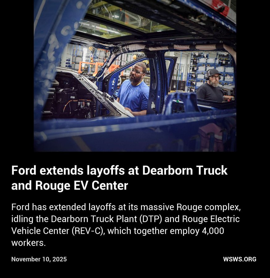 Image shows industrial factory interior with large blue Ford vehicles on assembly line, two workers one in blue shirt and one in black cap standing near open vehicle door inspecting parts, machinery and equipment in background highlighting automotive manufacturing environment.