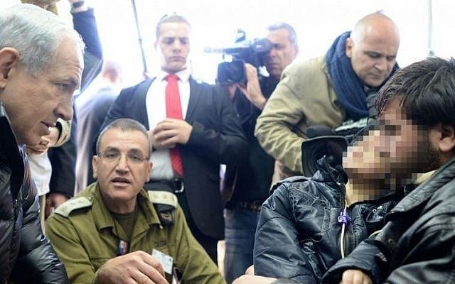 Prime Minister Benjamin Netanyahu visits an IDF field hospital for treatment of wounded from the civil war in Syria, in Ramat ha Golan, Northern Israel. February 18, 2014. (photo credit: Kobi Gideon /GPO/FLASH90) Prime Minister Benjamin Netanyahu visits an IDF field hospital for treatment of wounded from the civil war in Syria, in Ramat ha Golan, Northern Israel. February 18, 2014. (photo credit: Kobi Gideon /GPO/FLASH90)