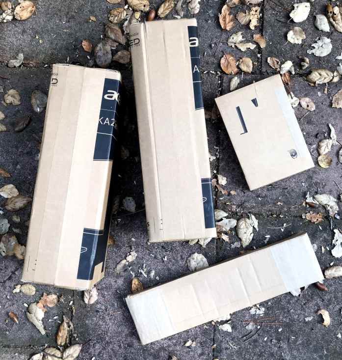 cardboard boxes taped closed with homemade paper tape and wheat paste