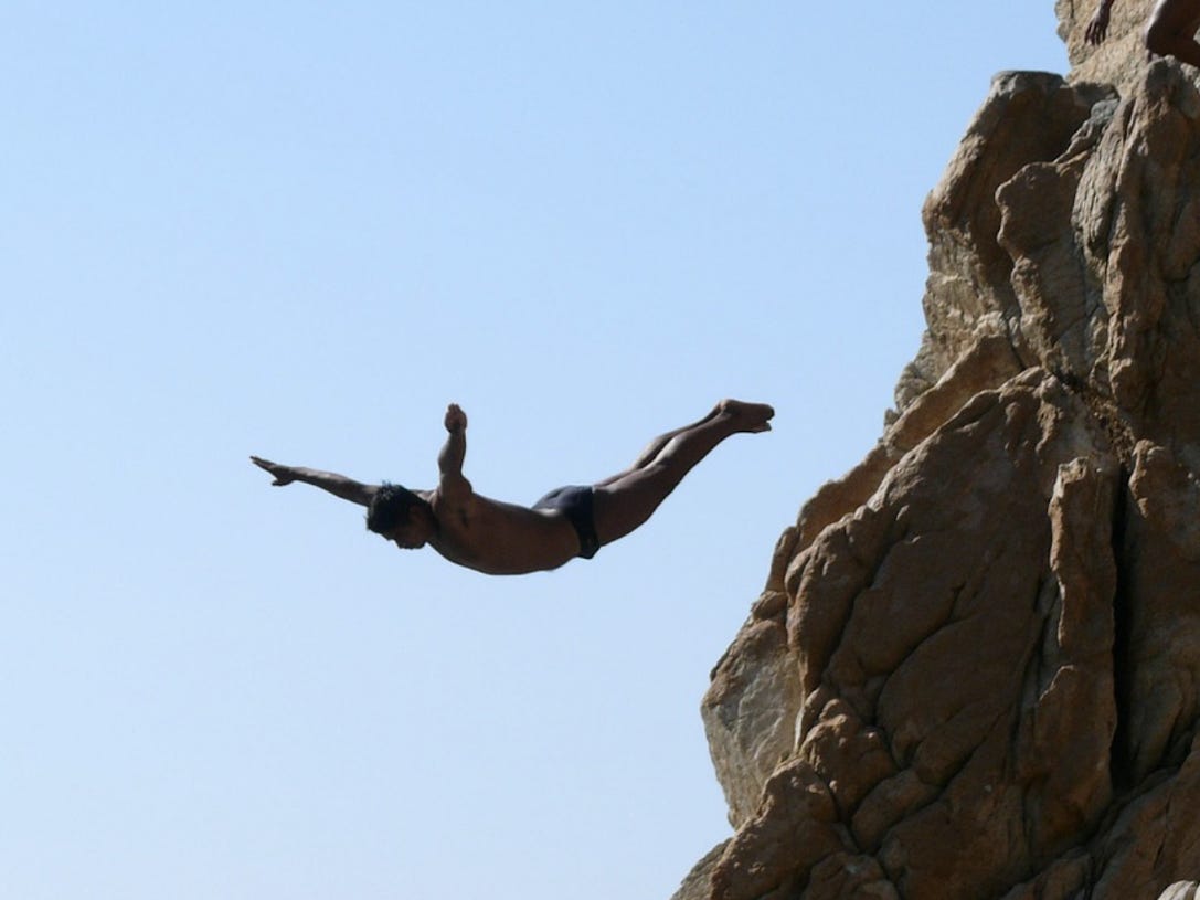 Man cliff diving