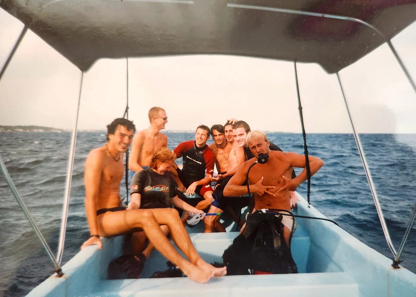 A group of divers, including Gentry Bronson, on a dive boat off the coast of the island of Utila, Honduras