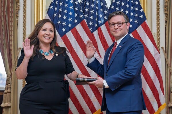 Speaker of the House Mike Johnson, R-La., holds a ceremonial swearing-in for Rep. Adelita Grijalva, D-Ariz., left, at the Capitol in Washington, Wednesday, Nov. 12, 2025. (AP Photo/J. Scott Applewhite)