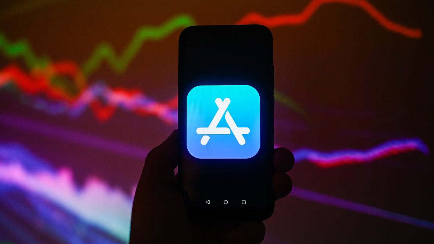 POLAND - 2024/03/21: In this photo illustration a Apple App Store logo is displayed on a smartphone with stock market percentages on the background. (Photo Illustration by Omar Marques/SOPA Images/LightRocket via Getty Images)