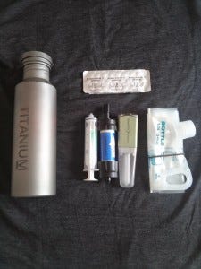 Inside the pouch, left to right: filter cleaning syringe, Sawyer Mini, and Steripen Freedom Inside the pouch, left to right: filter cleaning syringe, Sawyer Mini, and Steripen Freedom