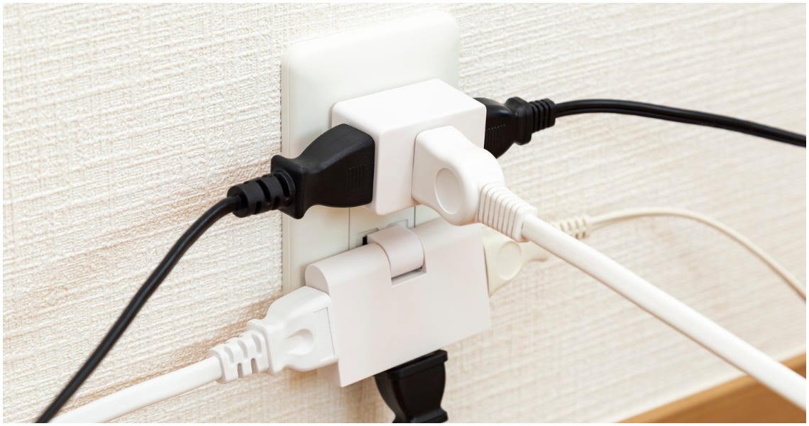 A collection of plugs plugged into sockets. 