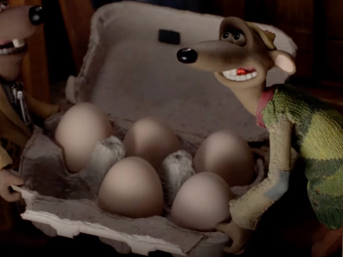 Rat from Chciken run holding a carton of eggs Rat from Chciken run holding a carton of eggs