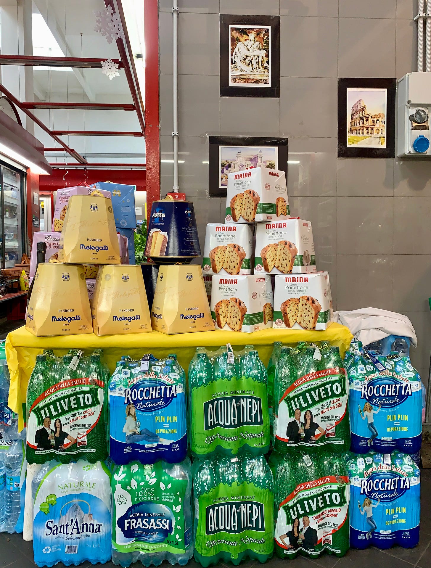 Panettone gift boxes stacked in an Italian grocery store