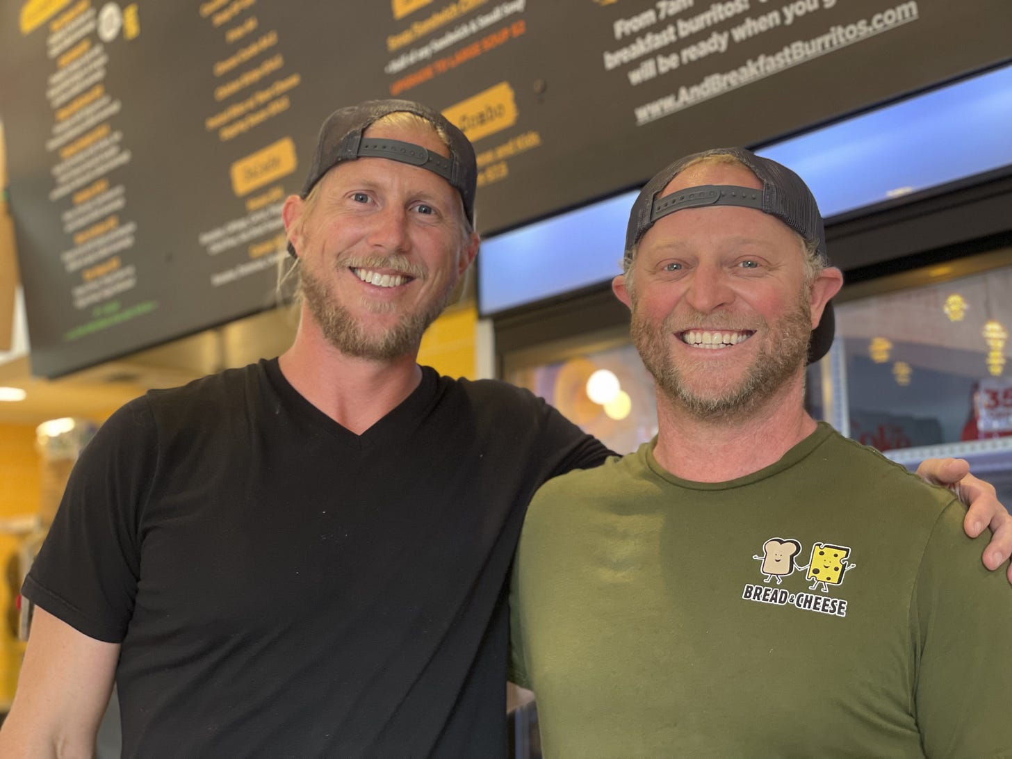 Devin Gneiting, left, and Justin Frank celebrated the grand opening of Bread and Cheese Eatery in South Oceanside on Monday. They also opened another concept in the restaurant called … and Breakfast Burritos. Steve Puterski photo