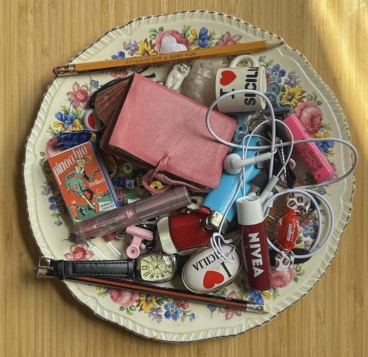 This may contain: a white plate topped with assorted items on top of a wooden table next to a pair of scissors