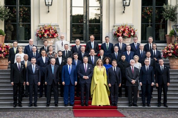 Participants pose for a family photo at the 2025 NATO summit in The Hague, on Tuesday, June 24, 2025. (Haiyun Jiang/Pool Photo via AP)