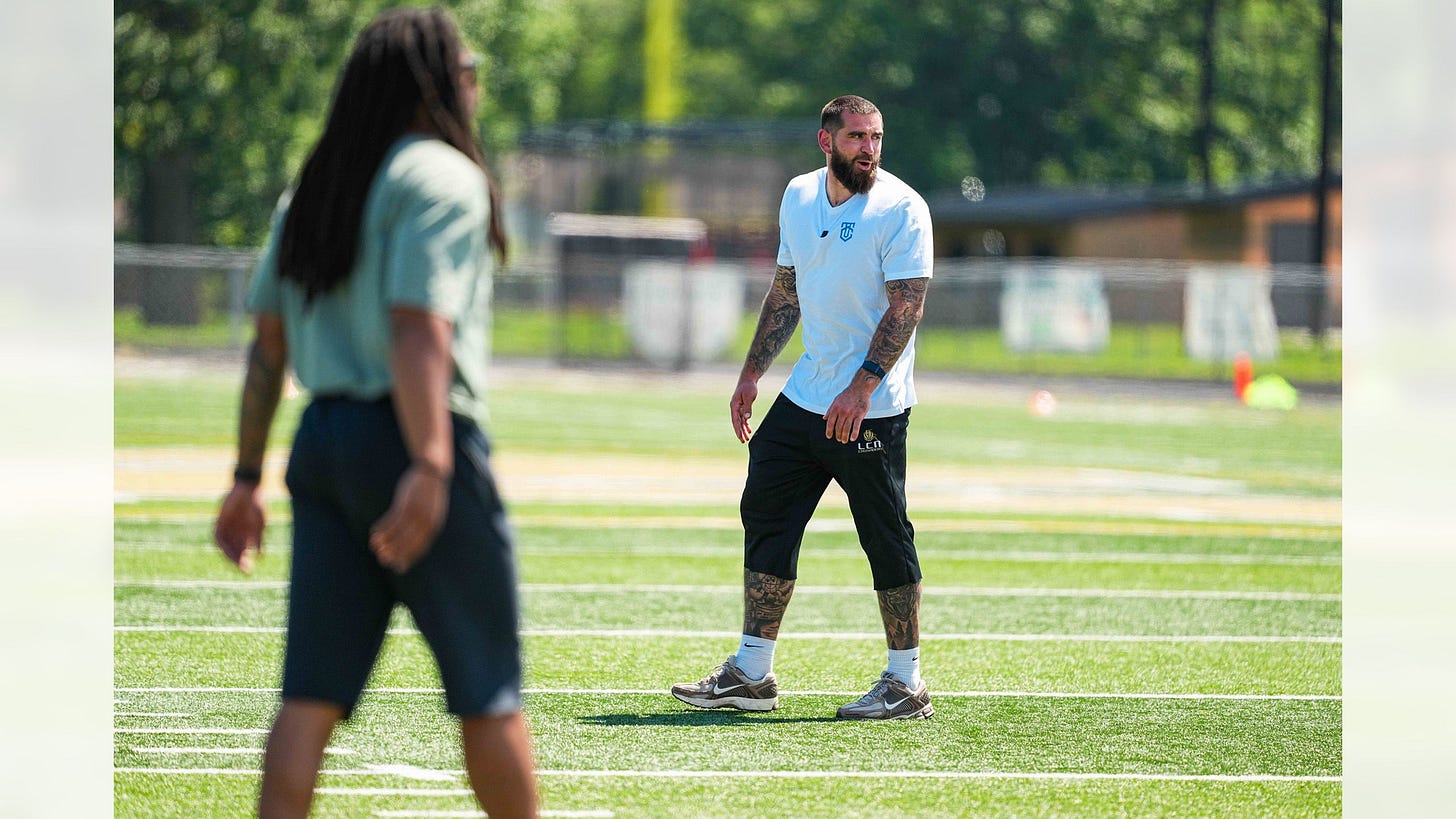 Tyler Conklin Detroit Lions at youth football camp