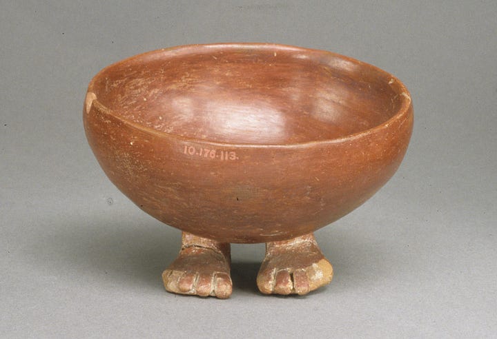 Glazed terracotta bowl with little human feet as the base