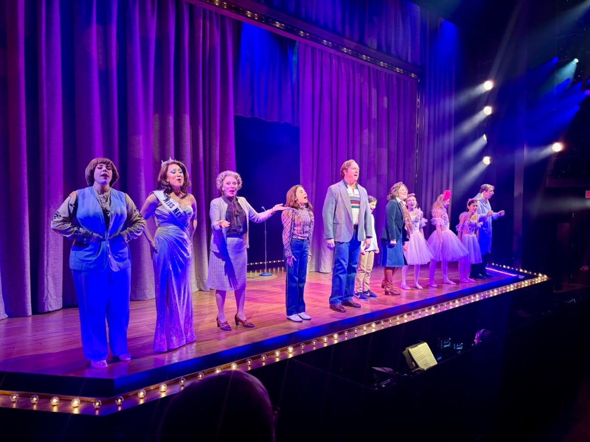 A group of people on a stage

Description automatically generated