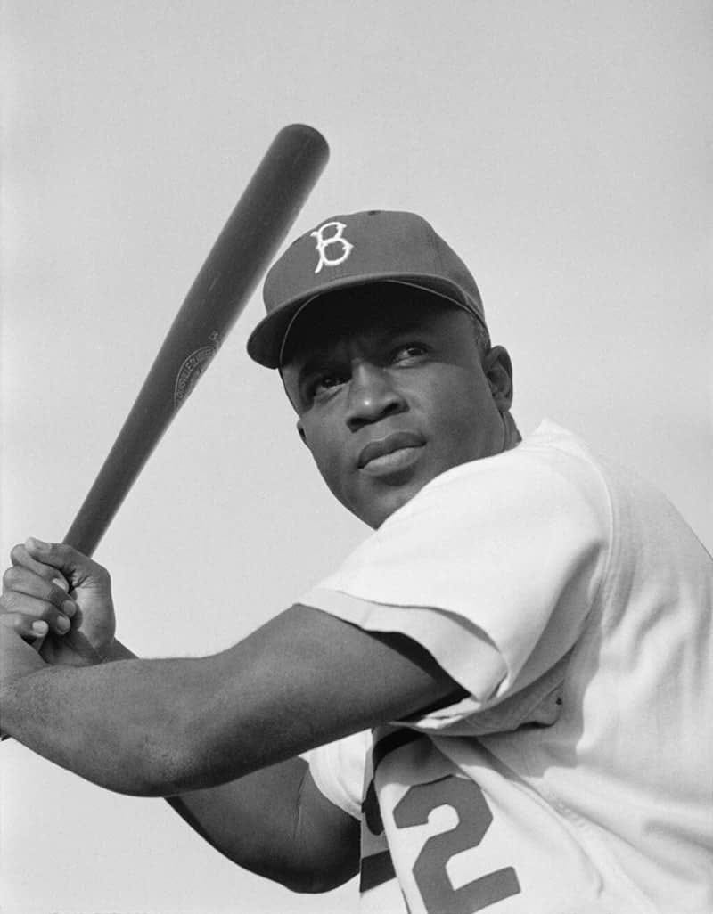 Jackie Robinson swinging for the Brooklyn Dodgers, 1954.