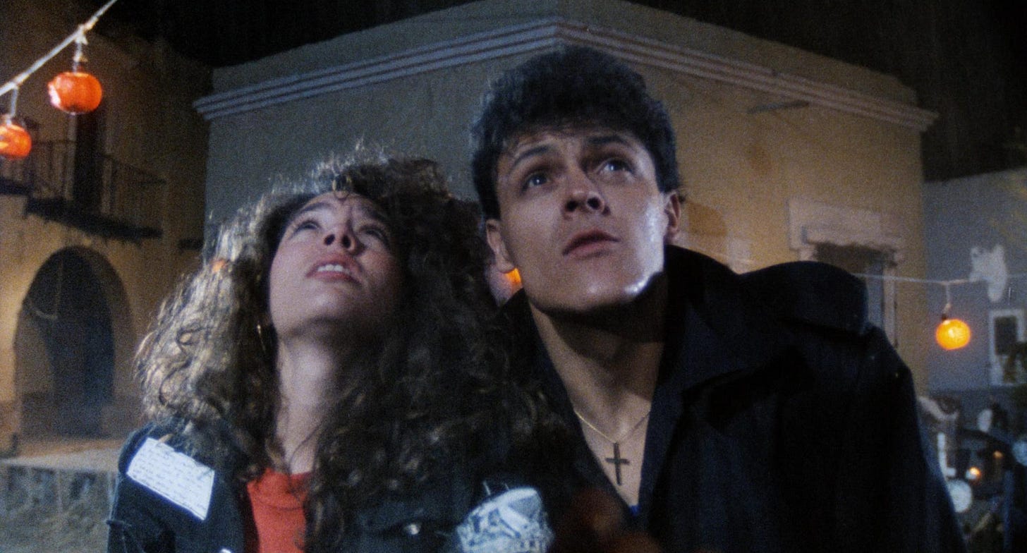 Pedro Fernandez and Tatiana looking upward in a shot from the 1991 Mexican horror movie, Vacaciones de Terror 2: Cumpleanos Diabolico