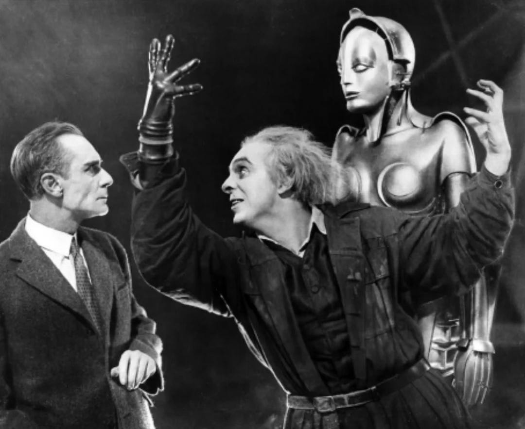 Crazed scientist Rotwang with gloved right hand gesticulates menacingly before wealthy industrialist, Frederson, in the silent science fiction classic Metropolis (1927) Crazed scientist Rotwang with gloved right hand gesticulates menacingly before wealthy industrialist, Frederson, in the silent science fiction classic Metropolis (1927)