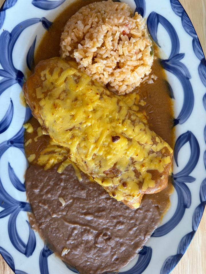 Enchiladas, chimichanga, and street corn at Frida’s