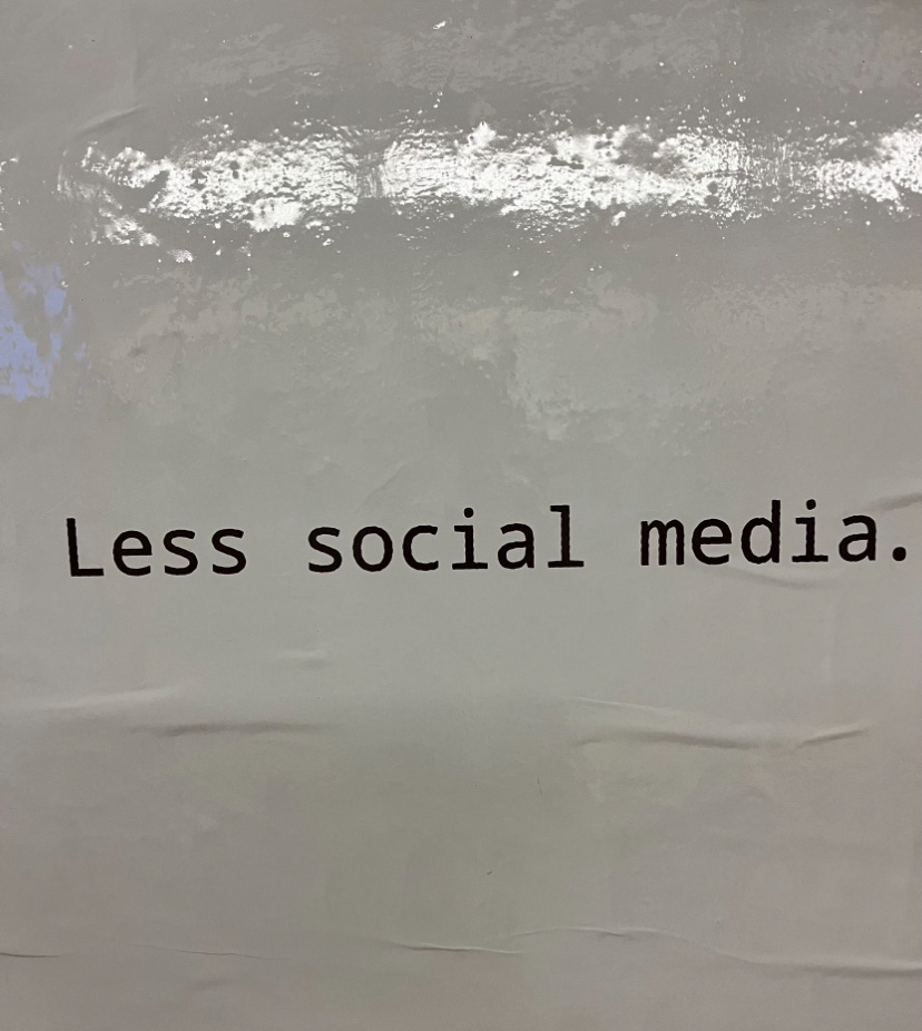 A subway advertisement that says Less Social Media on a plain white background.