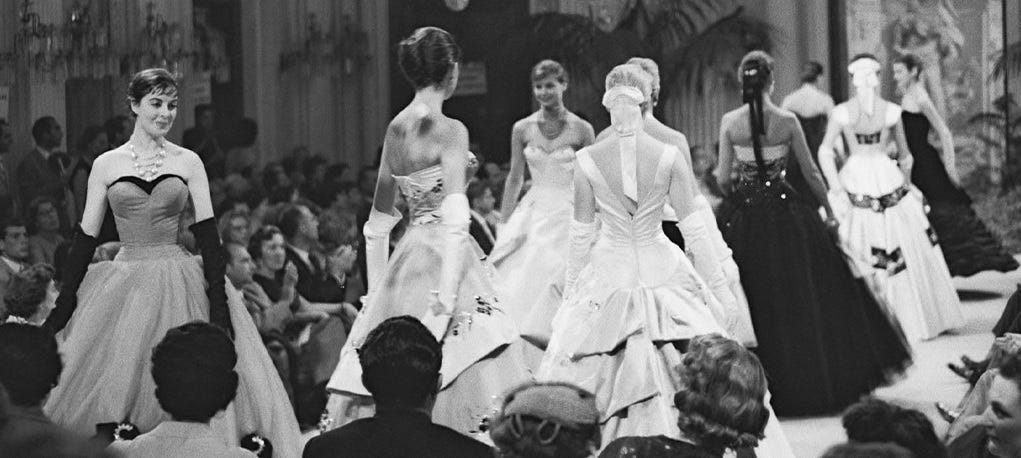 Several models wearing dresses at the first Italian fashion show held in Florence in 1952