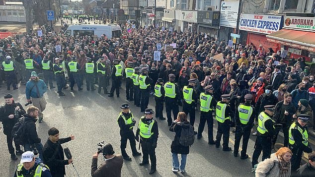 Hundreds of protesters gather in support of drag queen story-telling event  that is target of rally | Daily Mail Online