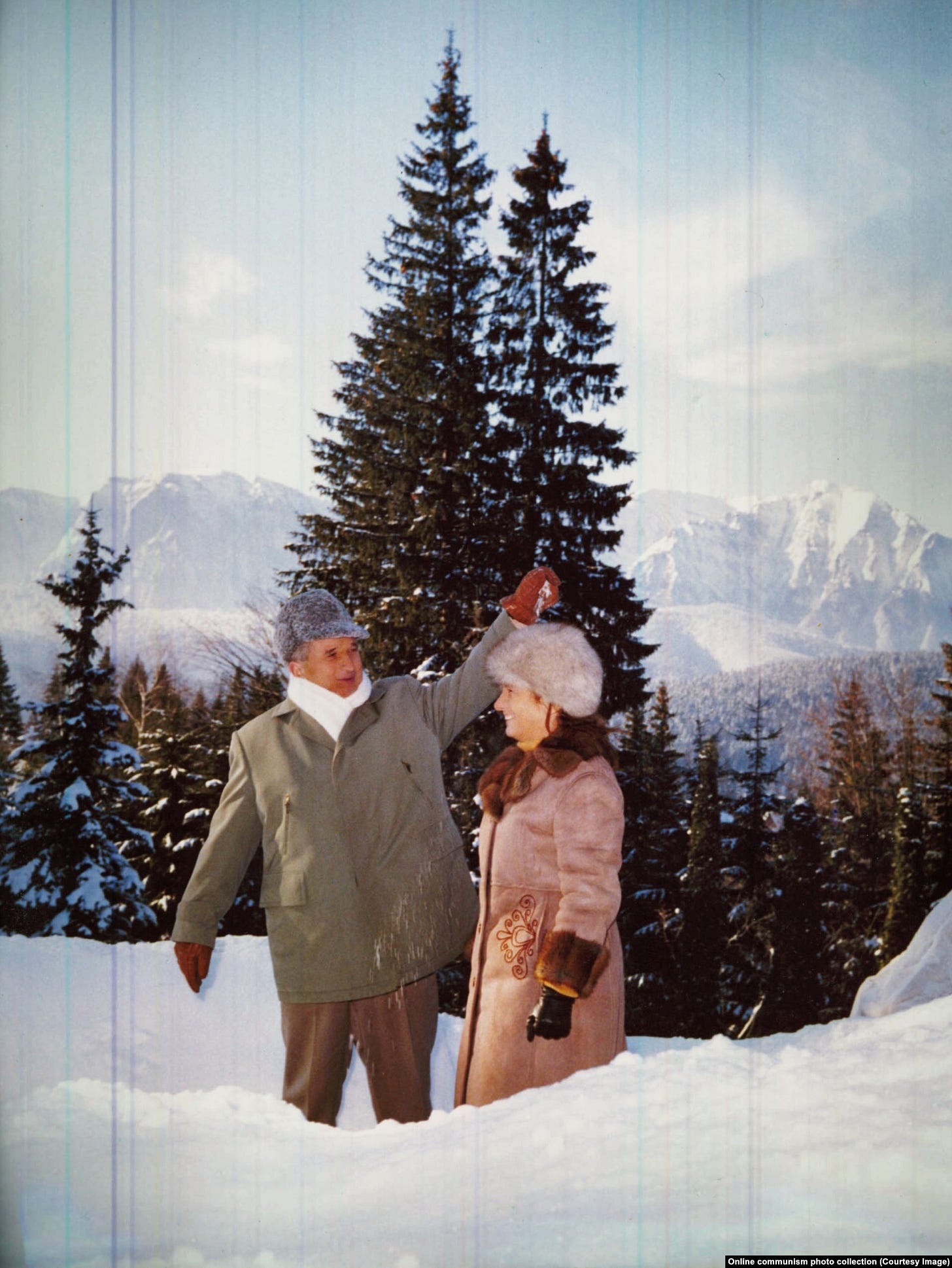 Ceausescu sprinkles snow on his wife’s head during yet another hunting trip in 1976.