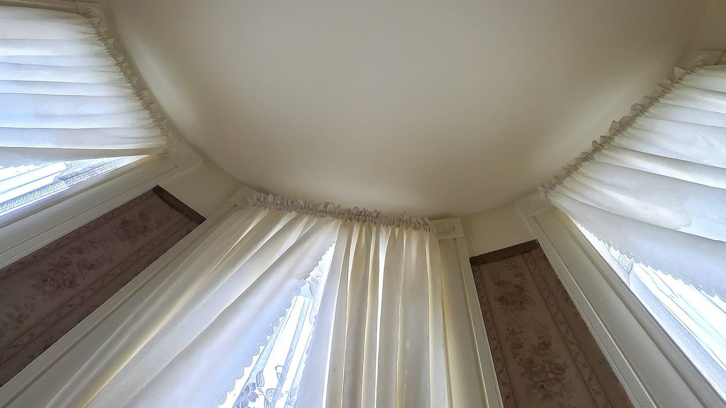 An interior image of where the ceiling and walls join in the curved room of the turret..