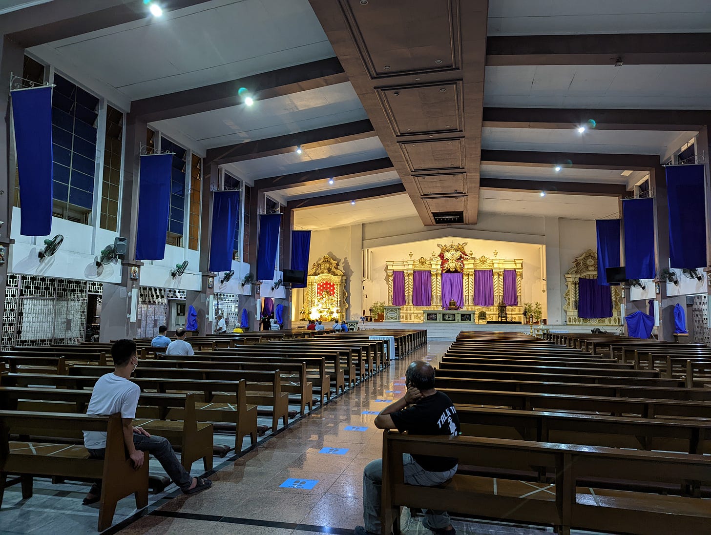 The somewhat simpler interior design of the Most Holy Redeemer Church showing a few visitors by the late hours