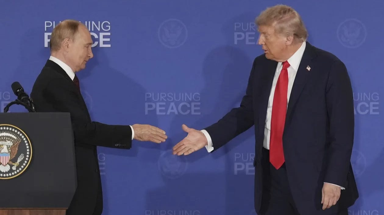 President Donald Trump, right, walks to shake the hand of Russia's President Vladimir Putin during a joint press conference at Joint Base Elmendorf-Richardson, Alaska, Friday, Aug. 15, 2025. (AP Photo/Jae C. Hong) | AP