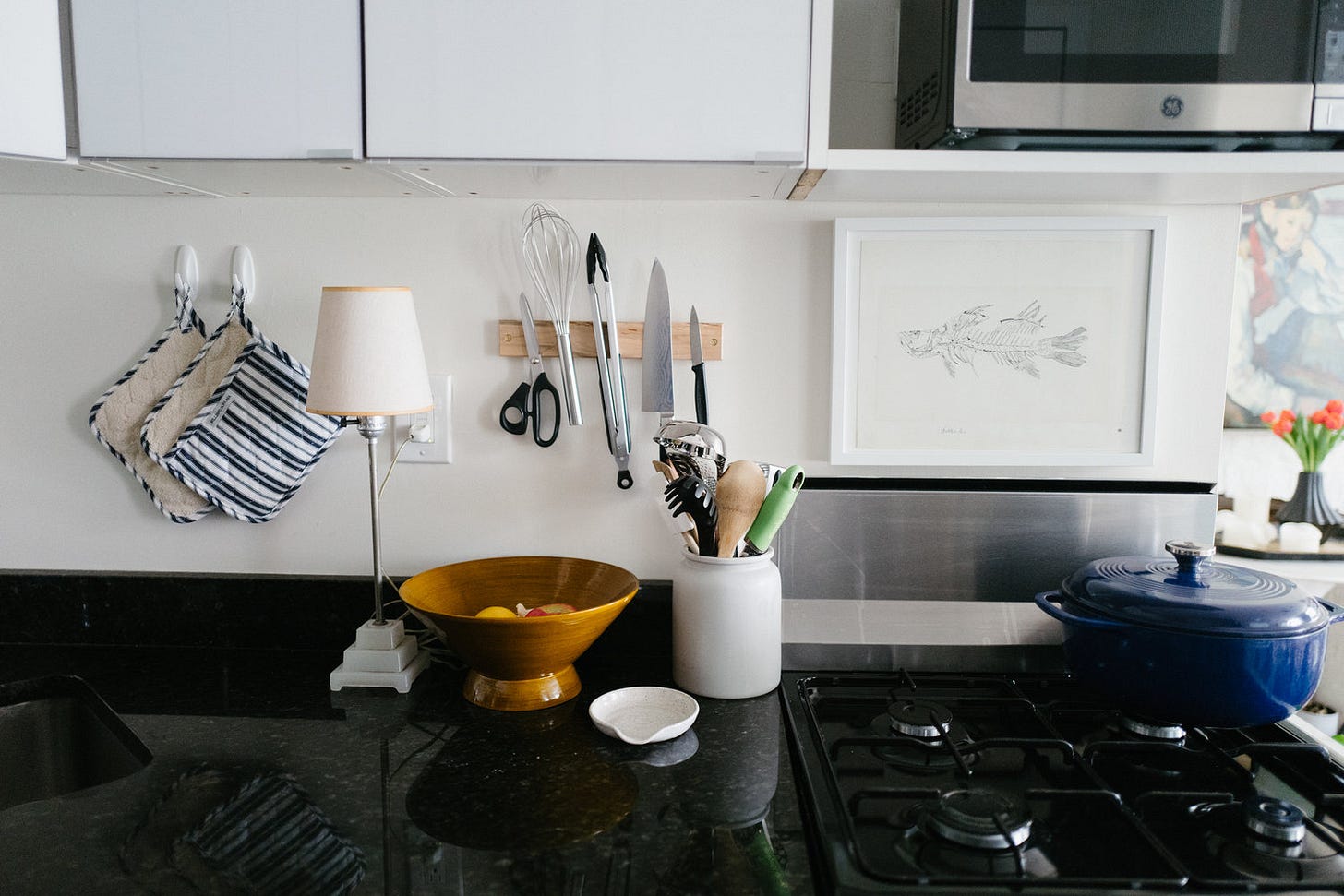 Blue dutch oven: Amazon. Lamp: vintage. Magnetic knife strip: Benchcrafted. Utensil holder: CB2. Spoon rest: Schoolhouse Electric. Fish print: Vintage. Pot holders: Williams Sonoma. Blue dutch oven: Amazon. Lamp: vintage. Magnetic knife strip: Benchcrafted. Utensil holder: CB2. Spoon rest: Schoolhouse Electric. Fish print: Vintage. Pot holders: Williams Sonoma.
