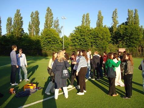 Graduates in front of an old chateau, five year high school reunion, five girls in Brussels