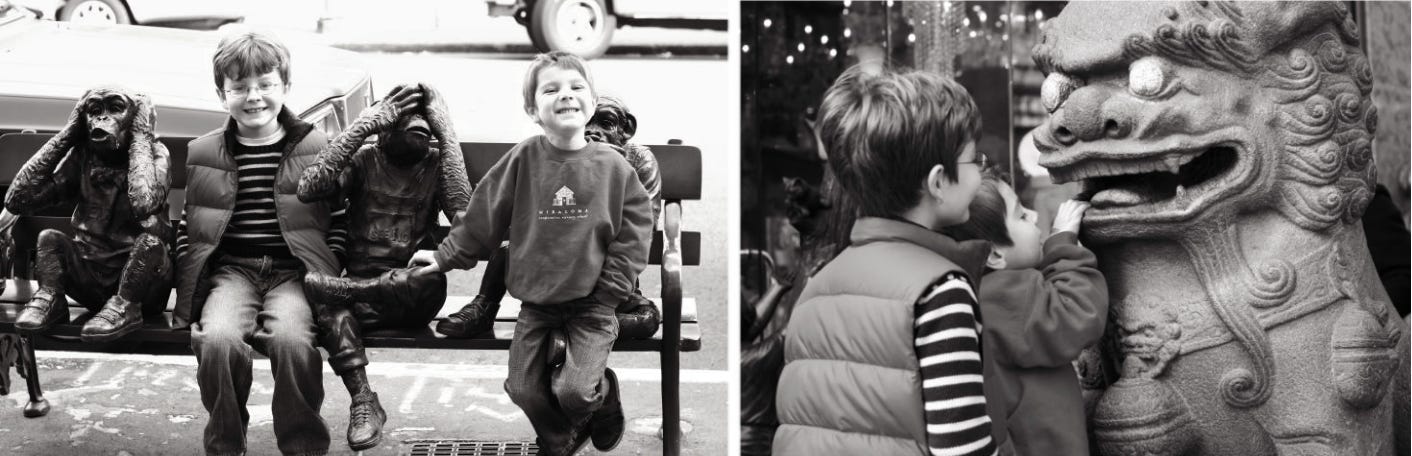 Boys sitting with monkey statues Boys sitting with monkey statues