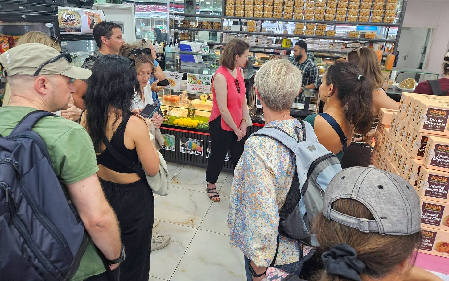 May be an image of one or more people, crowd, newsagent and text