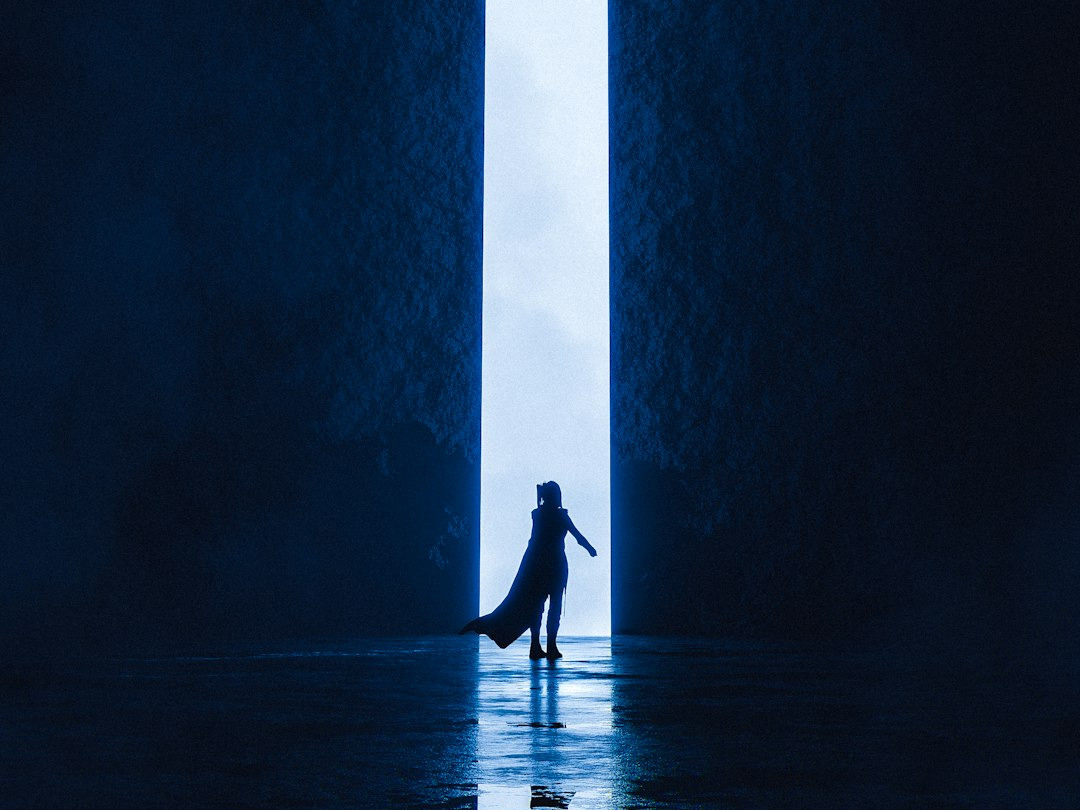 a person standing in the middle of a dark room