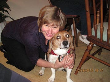 Darlene hugging one of her dogs. 
