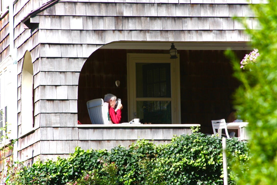 A person sitting in a chair in a window

AI-generated content may be incorrect.