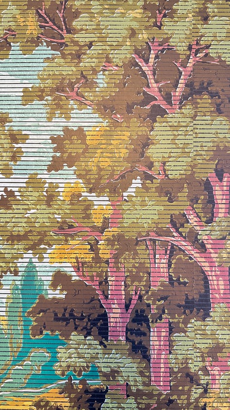 Closeup of wallpaper in the house - one of florals, one of woods, and one of yellow roses