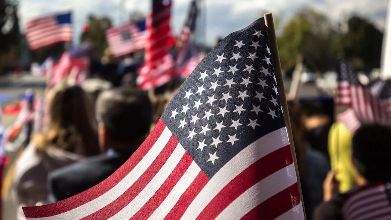 American flags at a protest rally against corruption and political division