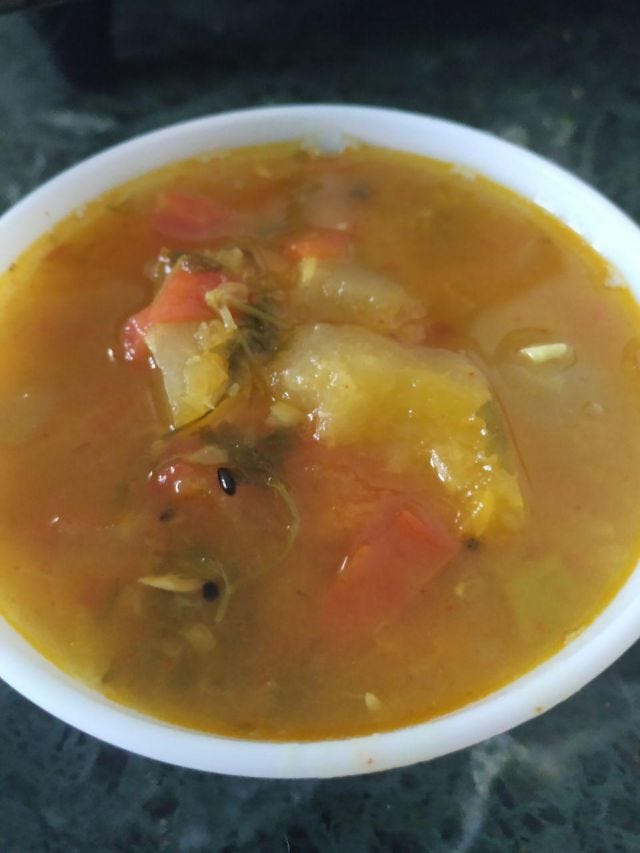 A dal with tomatoes and budamakayi (dosakayi) in it.