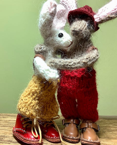 Two rabbits, discover a kiddy rabbit, in the pumpkin patch. They sit hi on a chair and have a cuddle.