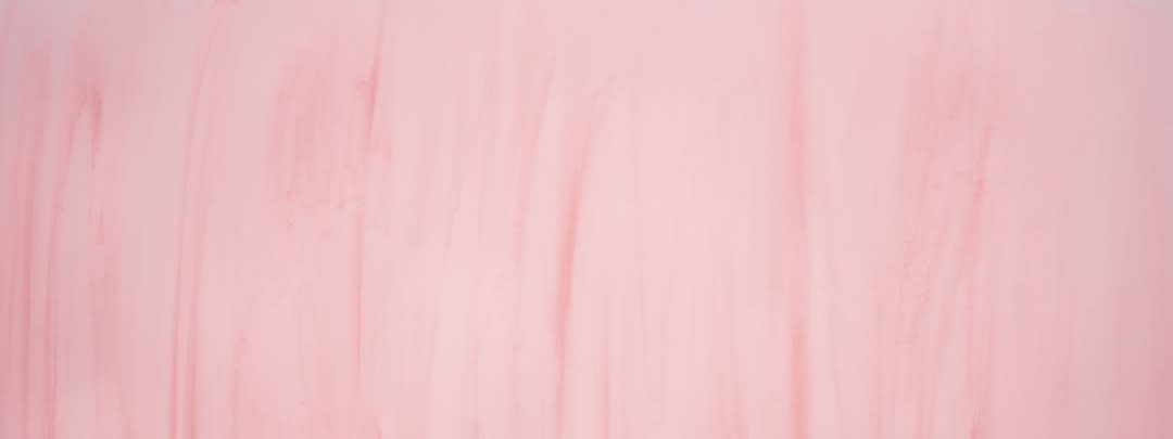 a painting of pink and white lines on a wall