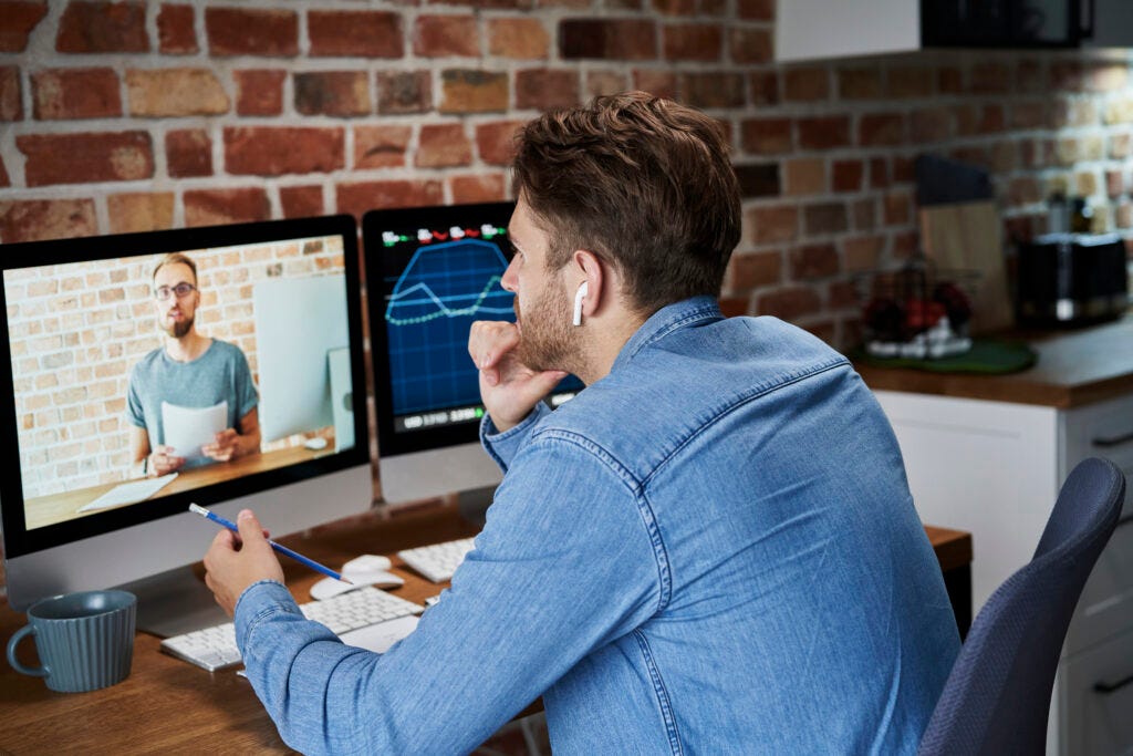 Adult man is taking an online management course Adult man is taking an online management course