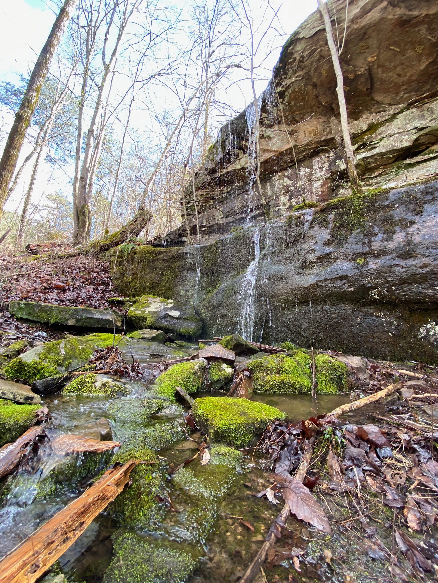 Small waterfall down some mossy rocks Small waterfall down some mossy rocks